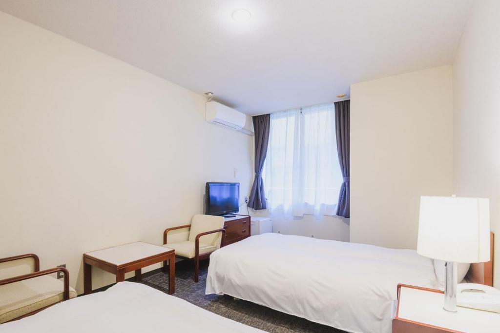 Postel nebo postele na pokoji v ubytování Ooedo Onsen Monogatari Awara