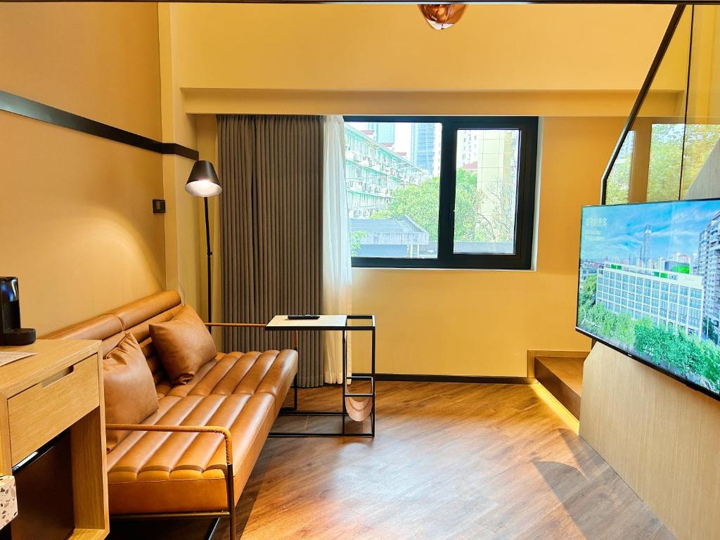 TV a/nebo společenská místnost v ubytování Mia Hotel - Shanghai Xuhui Jiaotong University