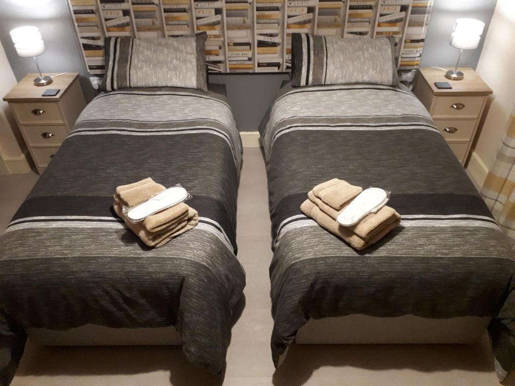 two beds sitting next to each other in a bedroom at SWIFT HALF in Ballyconnell