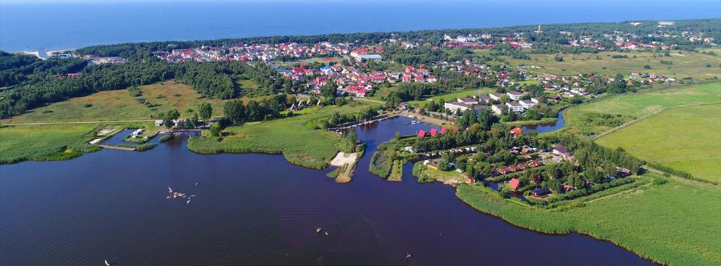 an aerial view of a small island in a lake at Stanica Wodna in Dźwirzyno