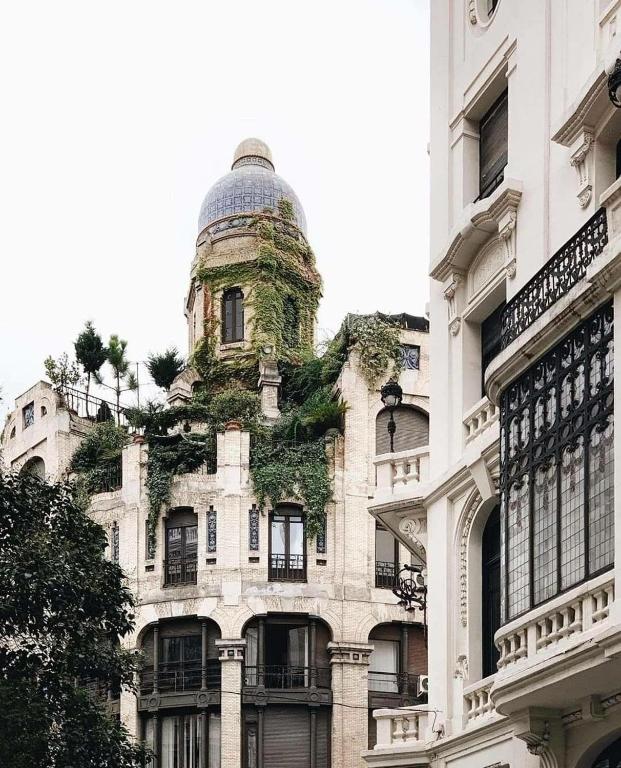 a building with a tower on top of it at HOSTAL ANDREA GRANVIA in Madrid