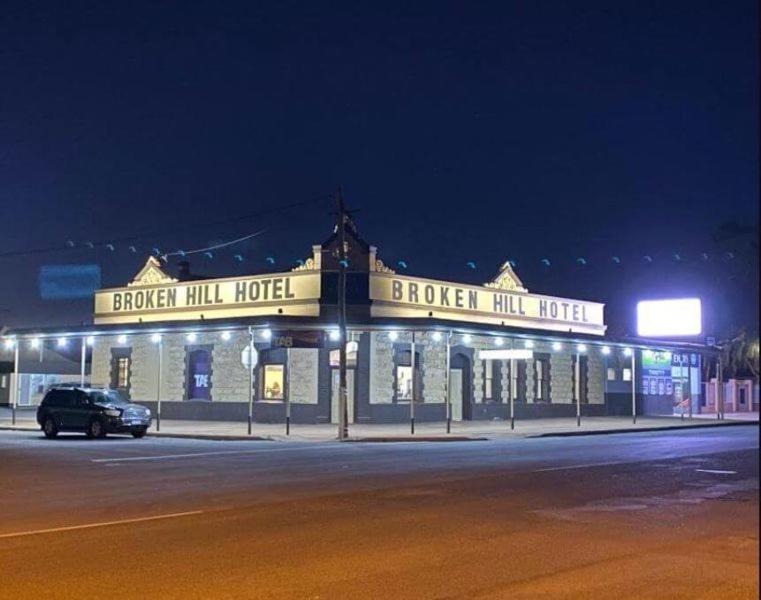 a building on the side of a street at night at Broken Hill Hotel in Boulder