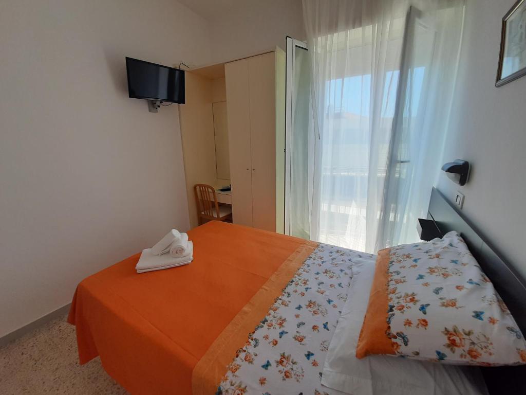 Postel nebo postele na pokoji v ubytování Hotel Vienna