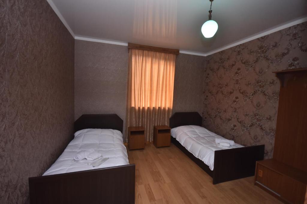 Postel nebo postele na pokoji v ubytování HOTEL SAMEGRELO