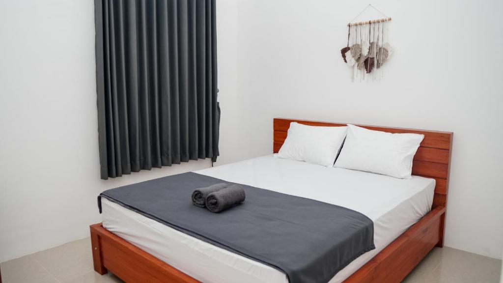 Postel nebo postele na pokoji v ubytování Wangi Homestay