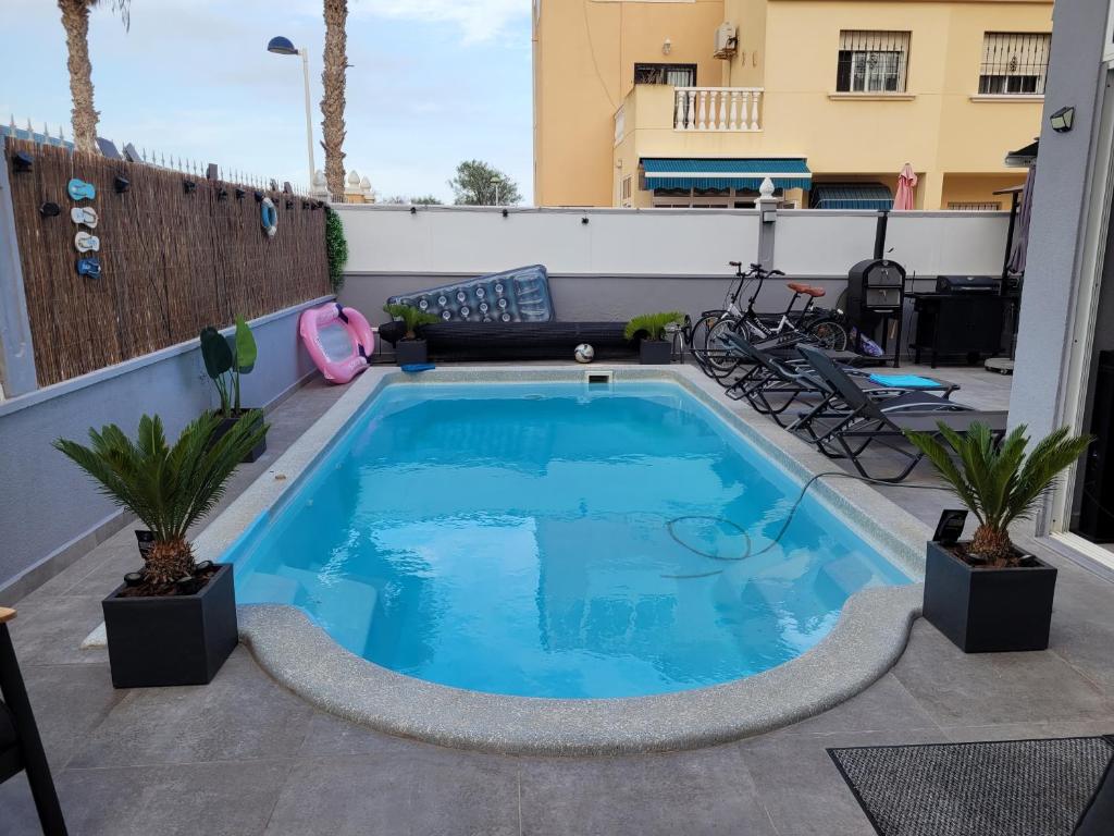 a swimming pool on the roof of a house at Casa Steven in Torrevieja