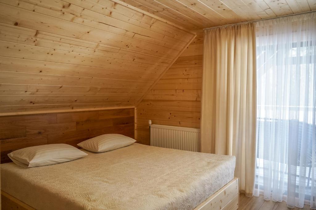 Postel nebo postele na pokoji v ubytování Ankamy Sweet Home