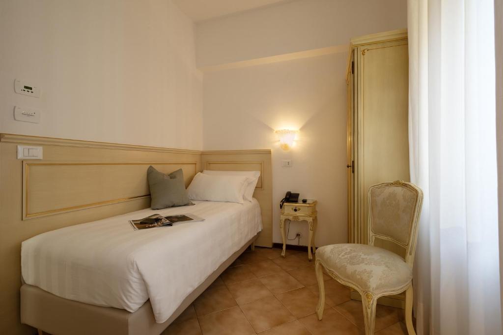 Postel nebo postele na pokoji v ubytování Hotel Guerrini