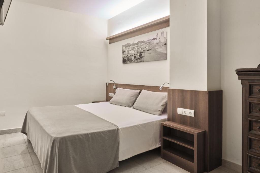 Postel nebo postele na pokoji v ubytování Sunway Playa Golf & Spa Sitges