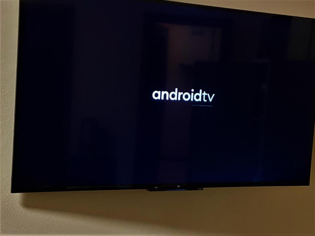 A television and/or entertainment centre at Affori Residence