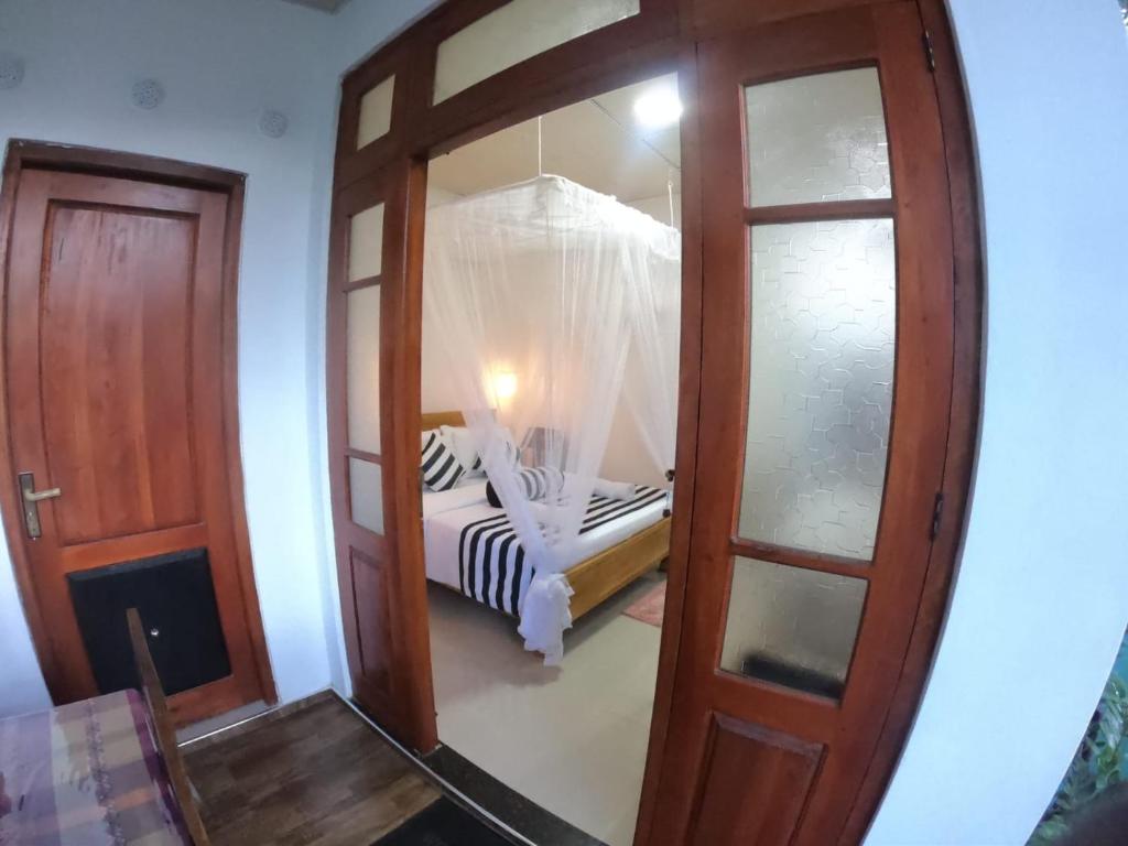 Postel nebo postele na pokoji v ubytování Ritz inn Ella