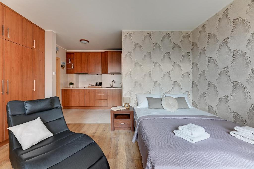 Posteľ alebo postele v izbe v ubytovaní Flatbook - City Center SPA Apartments Motlawa