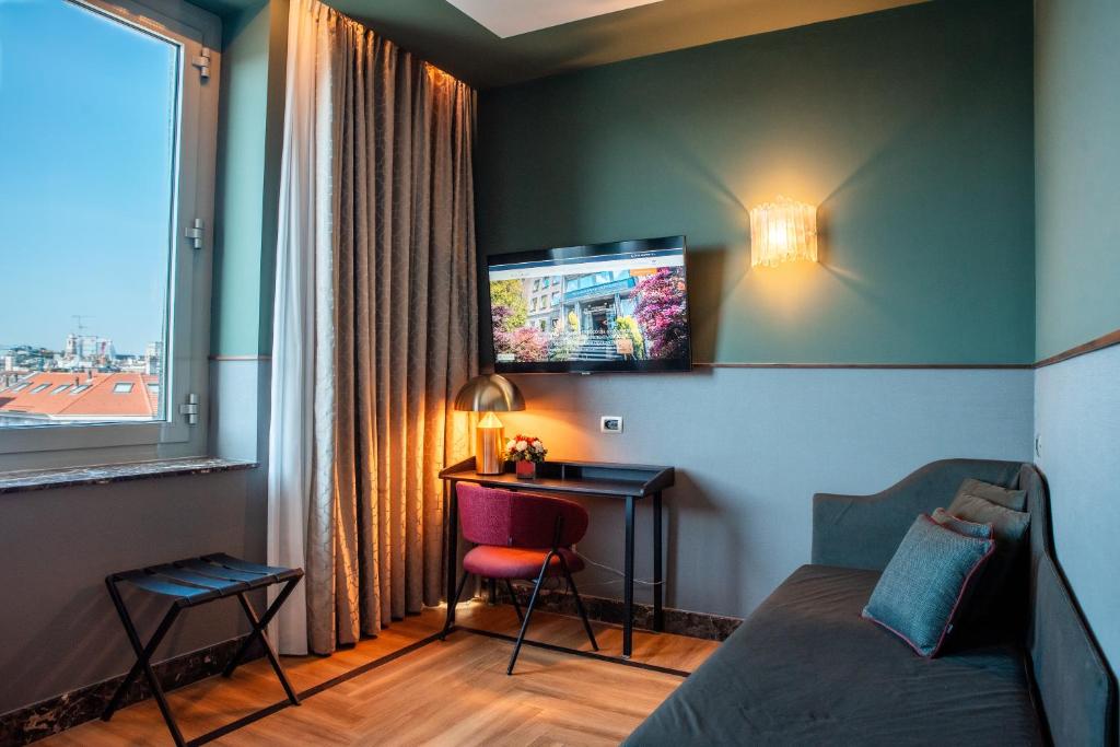 TV a/nebo společenská místnost v ubytování Bianca Maria Palace Hotel