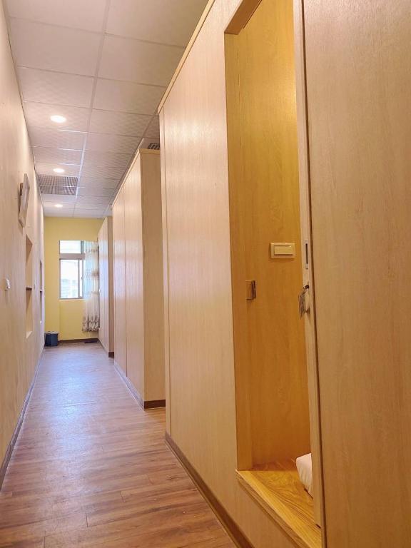 an empty hallway of an office building with a hallway at Kenting Heng-Chung Art Hostel in Hengchun