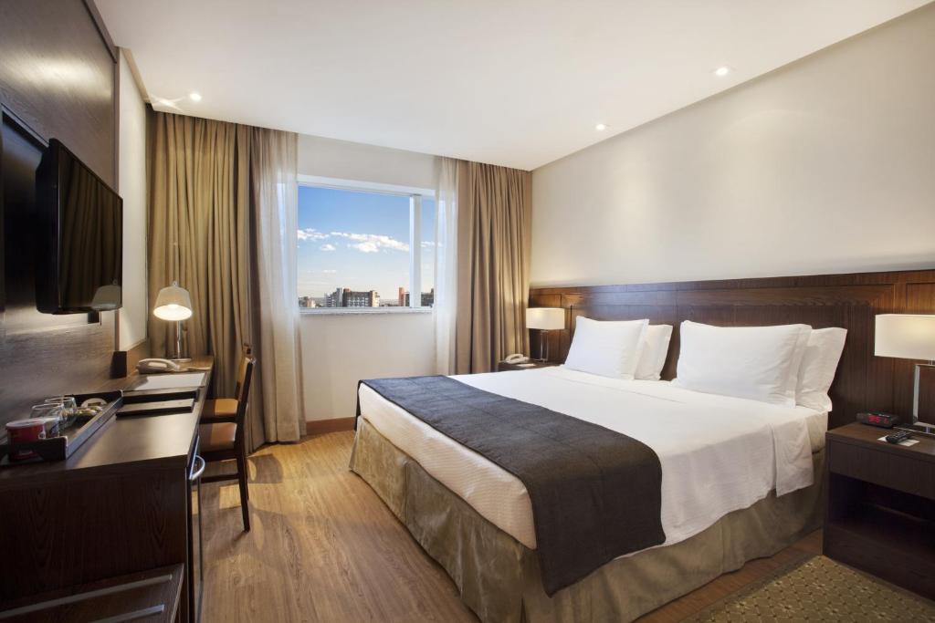 Postel nebo postele na pokoji v ubytování Windsor Brasilia Hotel