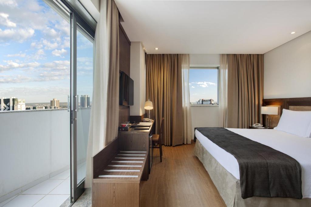 Postel nebo postele na pokoji v ubytování Windsor Brasilia Hotel