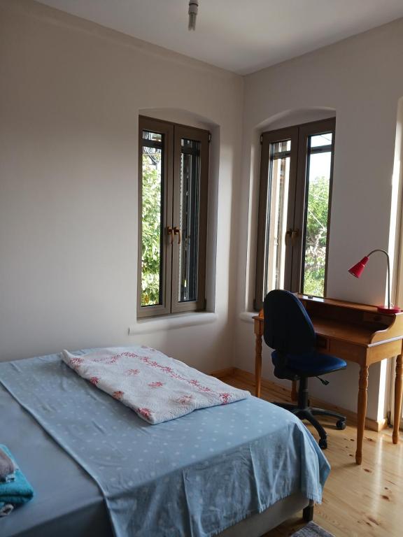 Postel nebo postele na pokoji v ubytování Vagia's Home