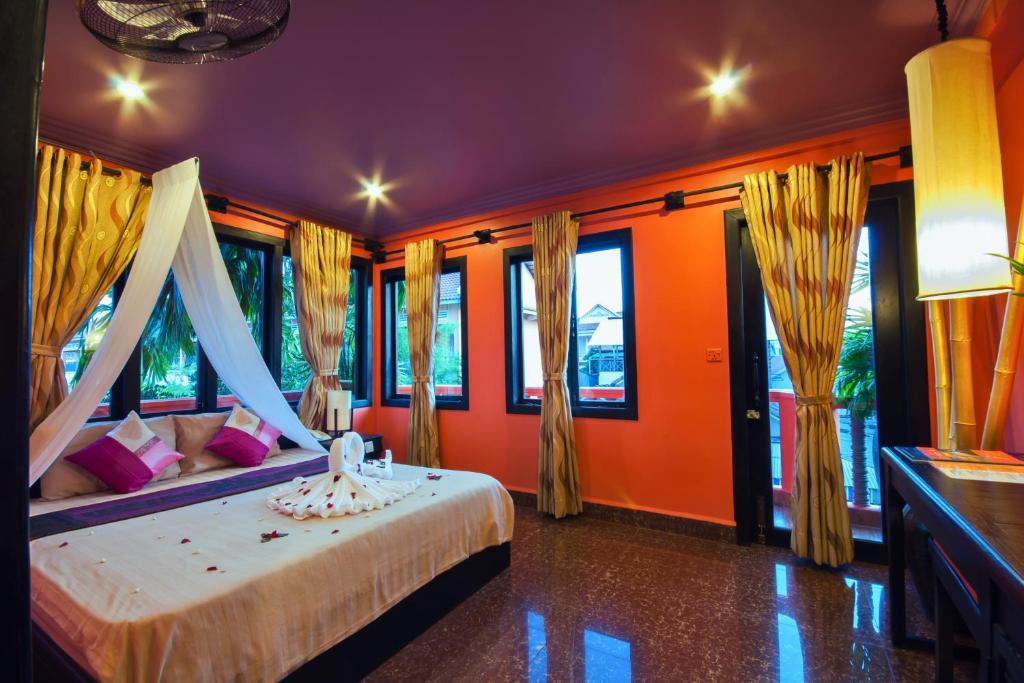 Postel nebo postele na pokoji v ubytování Golden Butterfly Villa
