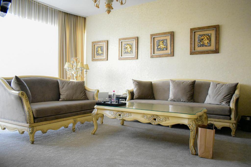 a living room with a couch and a coffee table at Hotel Feride in Vinnytsya