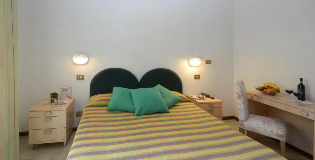 Postel nebo postele na pokoji v ubytování Albergo Martini