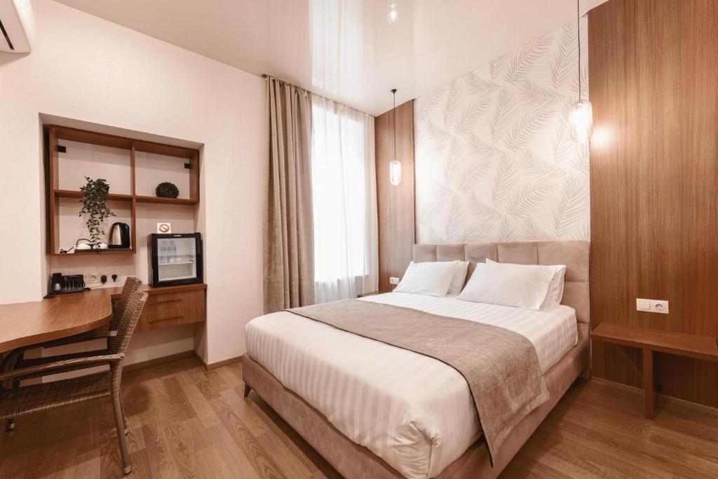 Postel nebo postele na pokoji v ubytování Park Hotel Tskaltubo - Balneo Resort