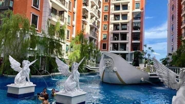 a water slide in the middle of a city at Espana Condo Jomtien Pool access By Aey in Jomtien Beach