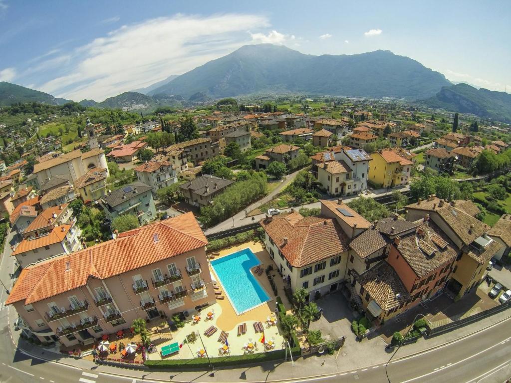 an aerial view of a town with a swimming pool at Hotel Alberello in Riva del Garda