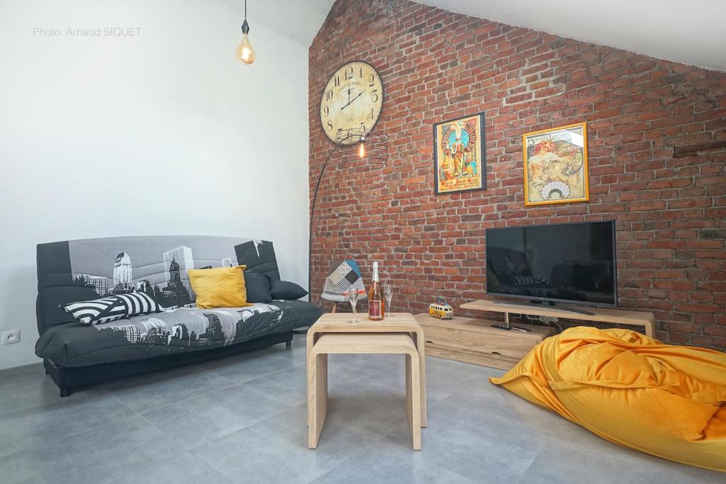 TV a/nebo společenská místnost v ubytování Gîte de la Madeleine