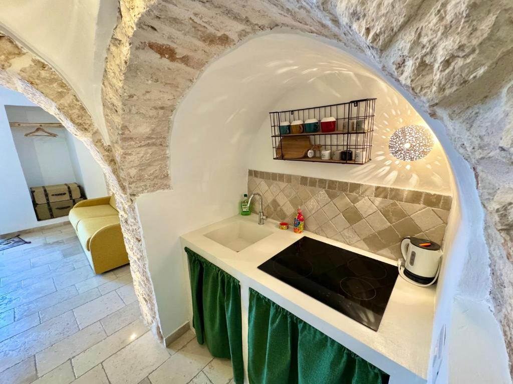 Kuchyň nebo kuchyňský kout v ubytování Trulli Moon