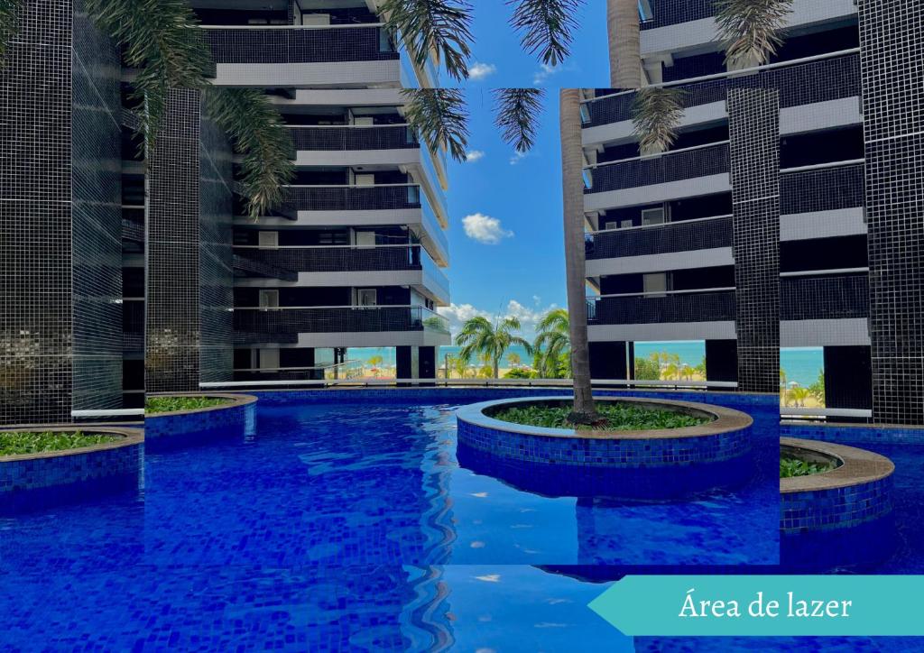 a rendering of a swimming pool with palm trees in front of a building at Landscape Beira-Mar Perfect in Fortaleza
