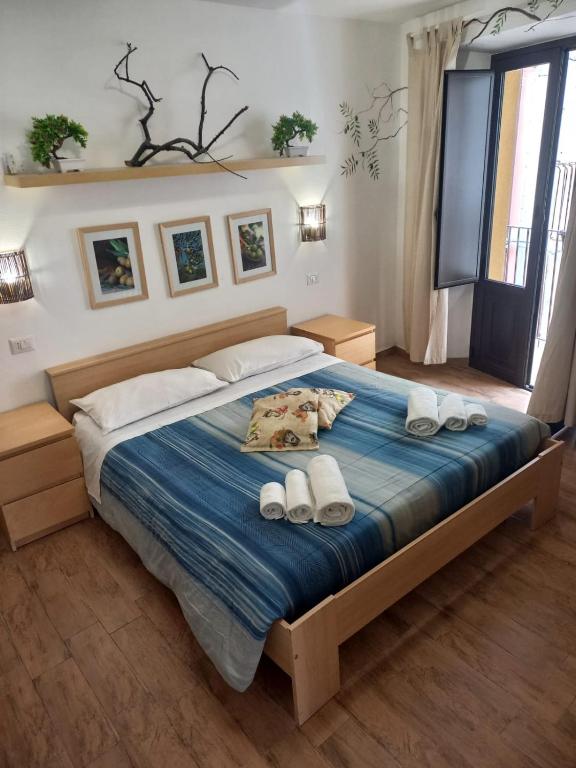 Postel nebo postele na pokoji v ubytování Antico Borgo - A due passi dalle Gole Alcantara