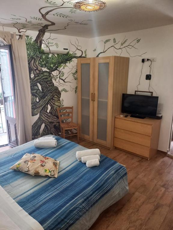Postel nebo postele na pokoji v ubytování Antico Borgo - A due passi dalle Gole Alcantara