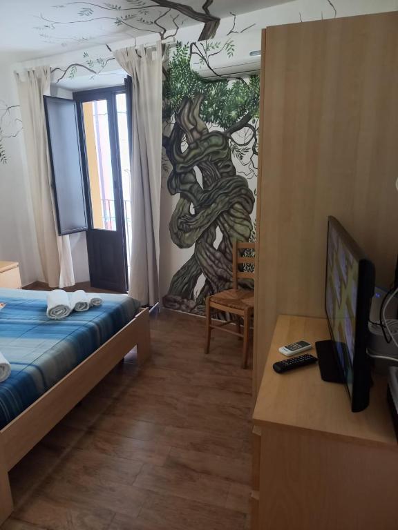 Postel nebo postele na pokoji v ubytování Antico Borgo - A due passi dalle Gole Alcantara