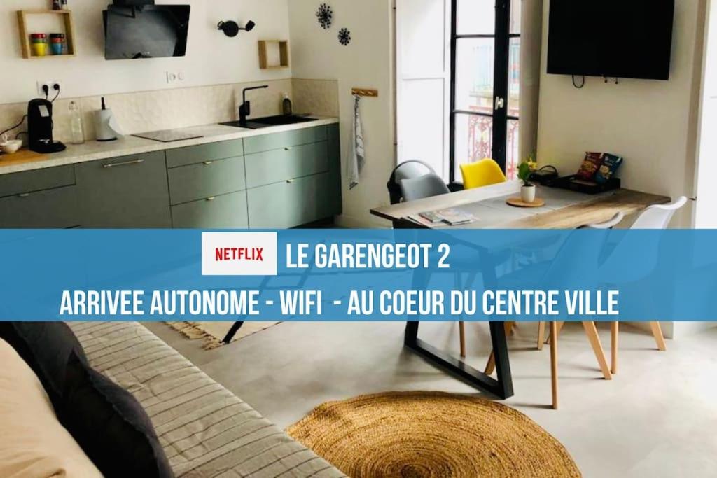 a living room with a couch and a table at LE GARENGEOT 2 -WIFi-CENTRE VILLE in Vitré