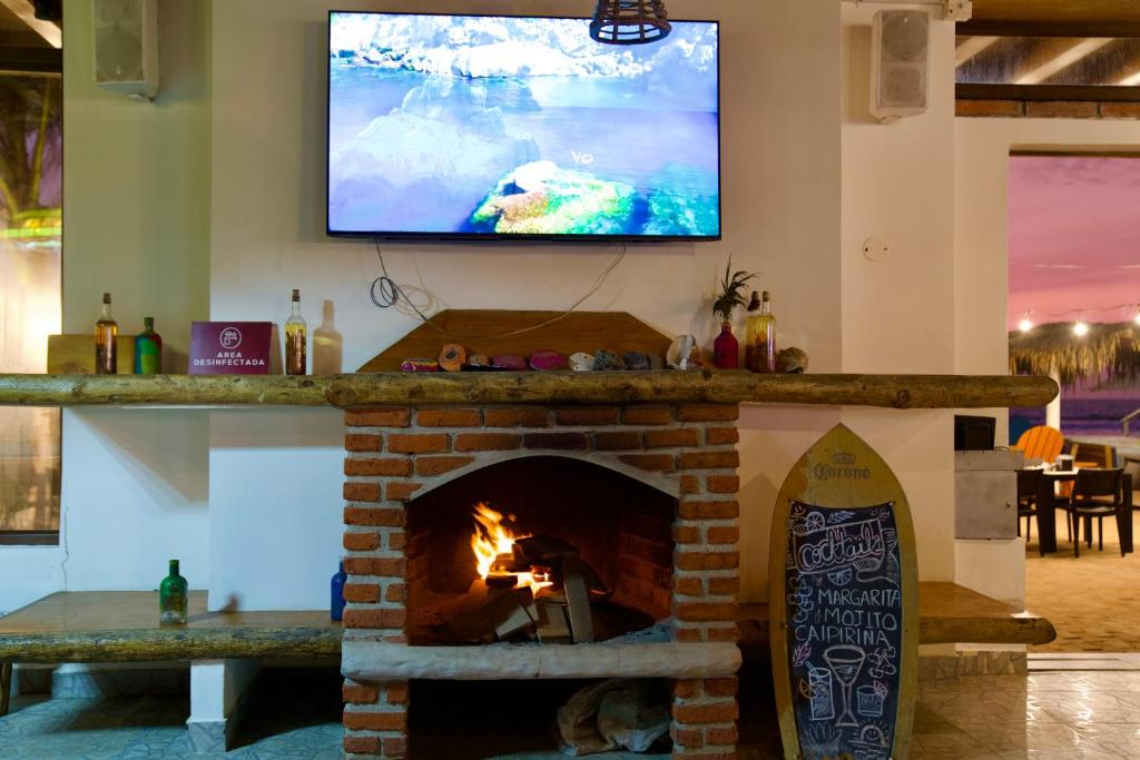 TV a/nebo společenská místnost v ubytování Playa Paraíso