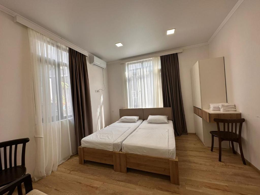 Postel nebo postele na pokoji v ubytování Middle city Guesthouse