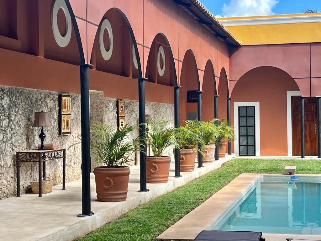 Bazén v ubytování Hotel Hacienda Mérida nebo v jeho okolí