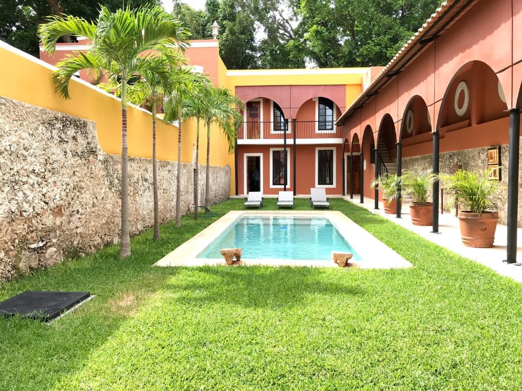 Bazén v ubytování Hotel Hacienda Mérida nebo v jeho okolí