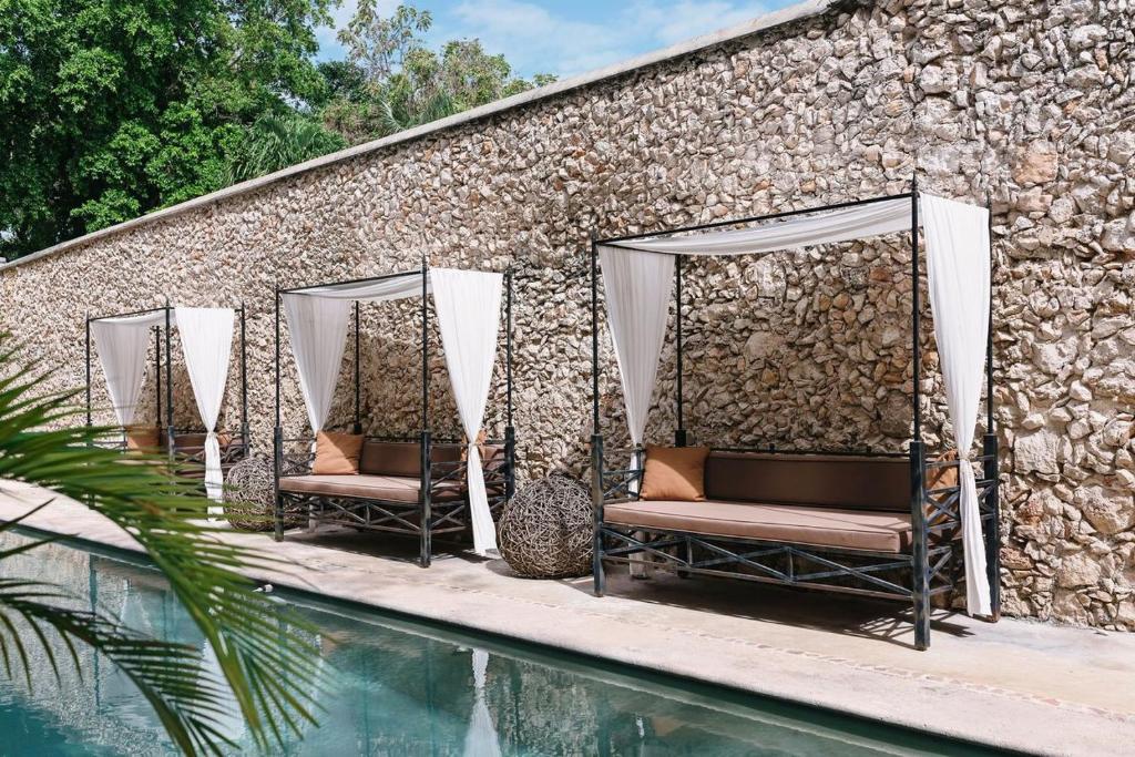 Bazén v ubytování Hotel Hacienda Mérida VIP nebo v jeho okolí