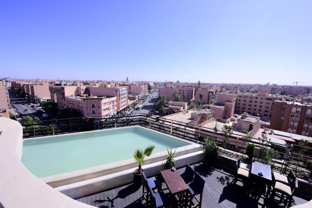 a large swimming pool on top of a building at Sky Boutique Ennahda Rennaissance in Marrakech