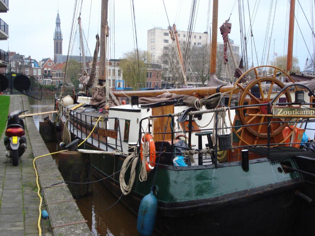 a couple of boats docked in a harbor at Spes Mea in Groningen