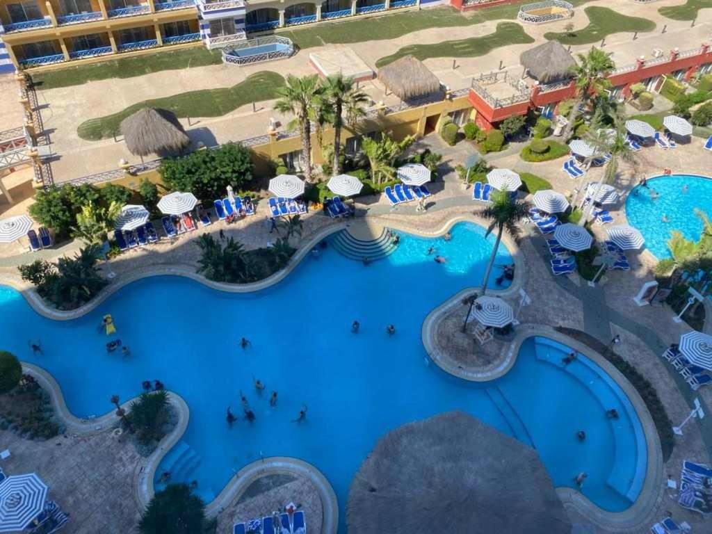 an aerial view of a pool at a resort at Porto marina for rent in El Alamein
