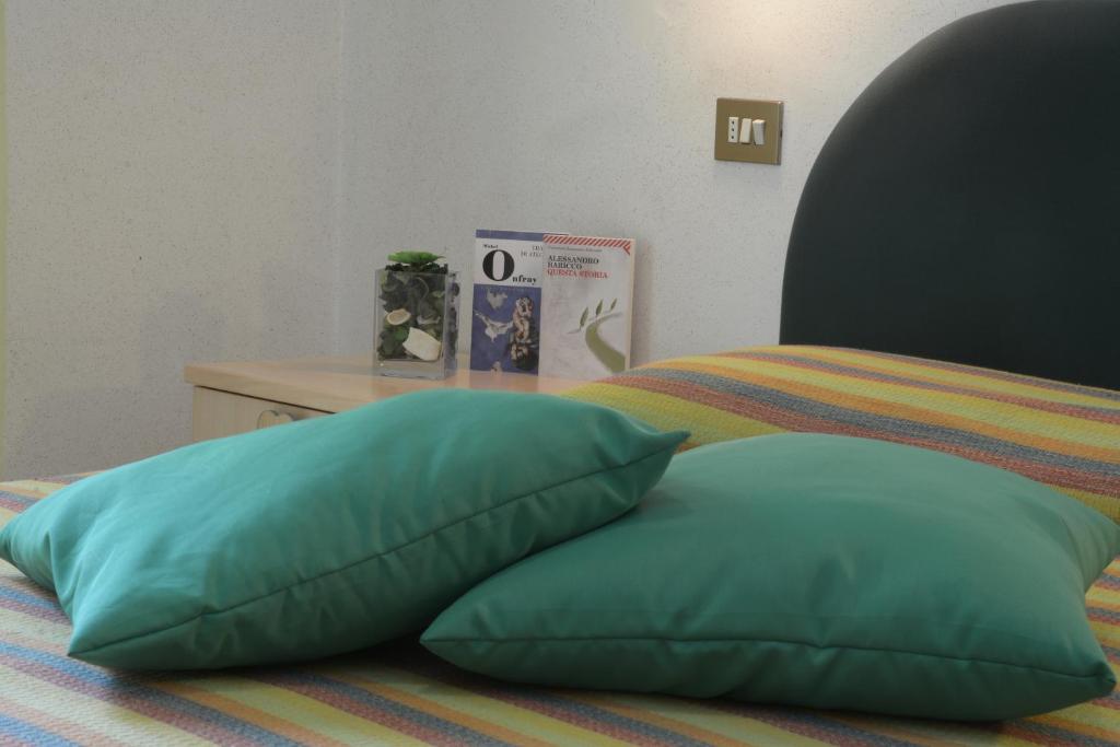 Postel nebo postele na pokoji v ubytování Albergo Martini