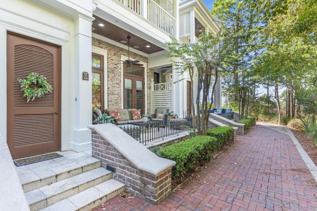 a home with a brick walkway leading to the front door at Le Jardin 168 - 3BR 3.5BA - (10) in Destin