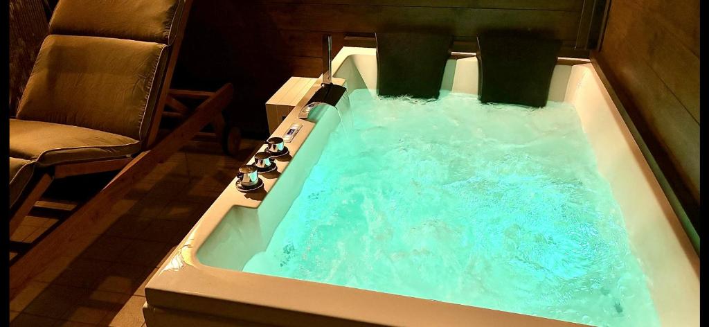 a bath tub filled with water in a room at B&B Desenzano Paradise in Desenzano del Garda