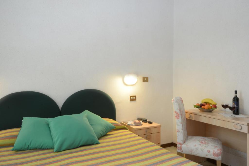 Postel nebo postele na pokoji v ubytování Albergo Martini