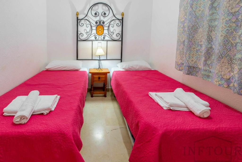 Posteľ alebo postele v izbe v ubytovaní Inftour Medici Apartamento