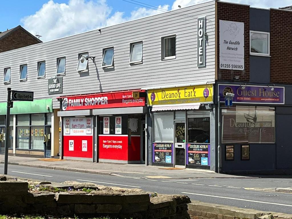 a group of shops on the side of a street at The Goodlife Guesthouse in Harwich
