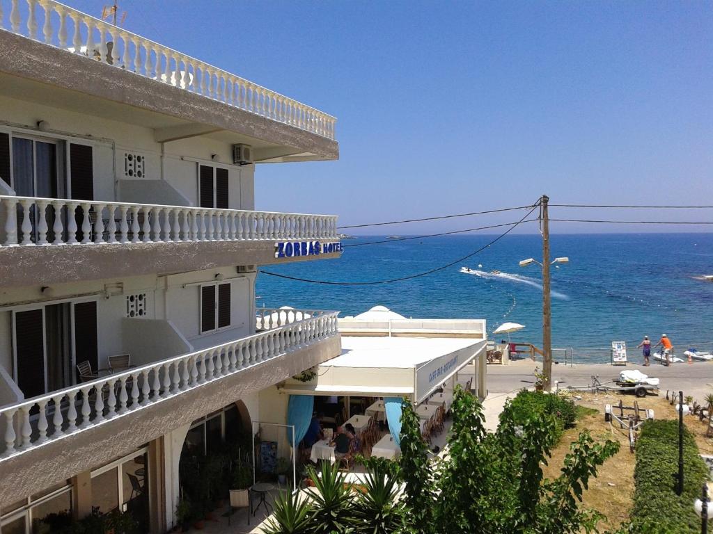 a building with a view of the ocean at Zorbas Hotel in Hersonissos