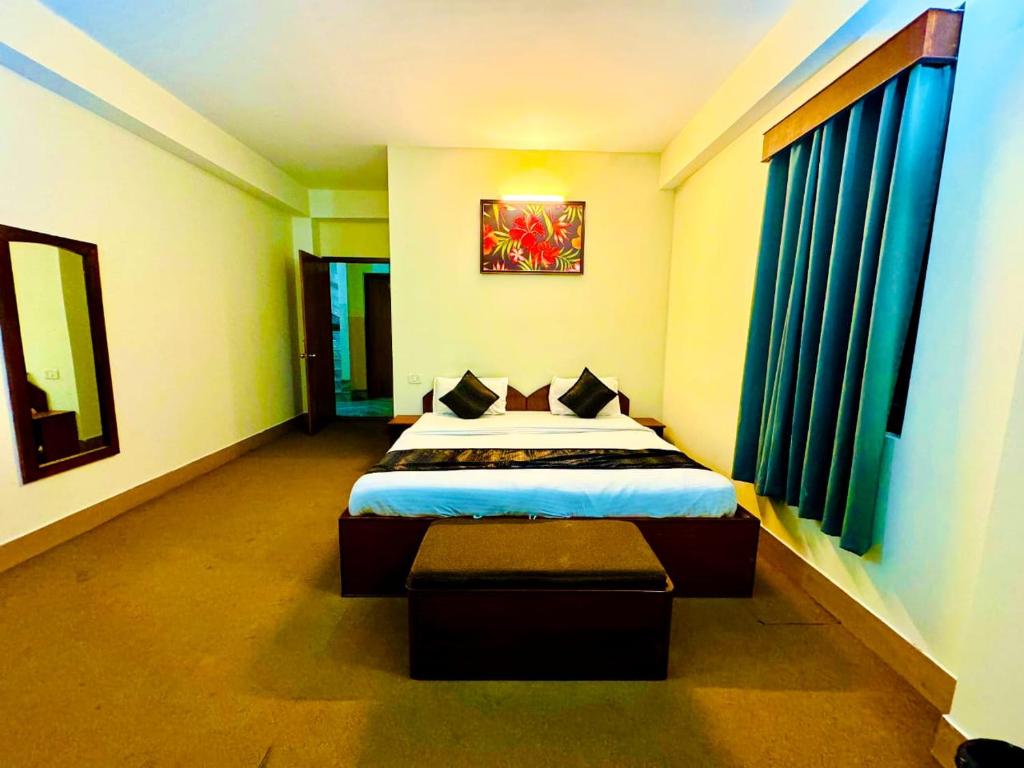 Mayel-Lyang Residency tesisinde bir odada yatak veya yataklar